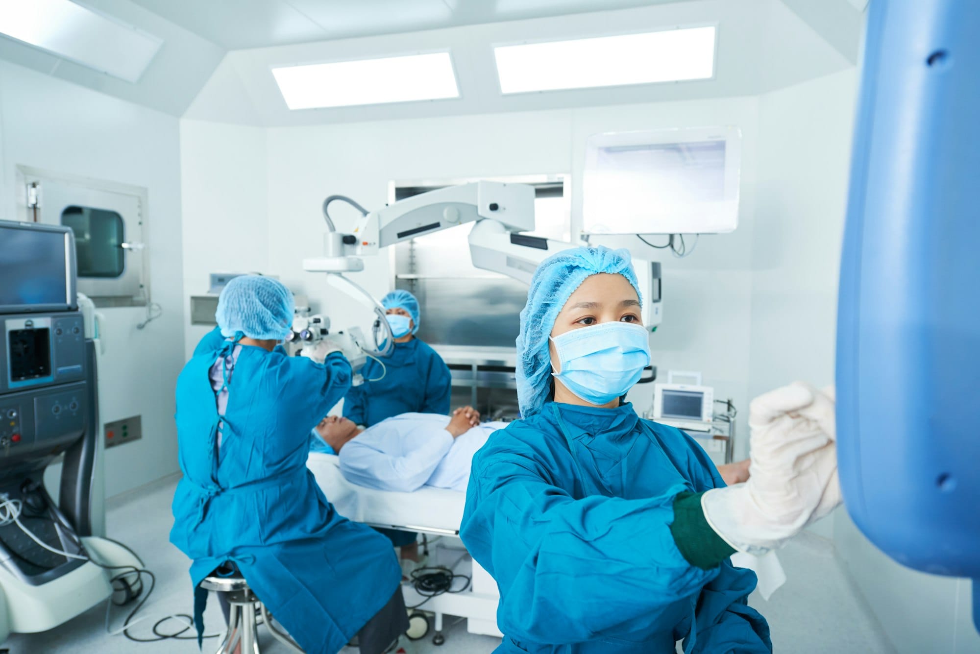 Asian surgeons performing surgery