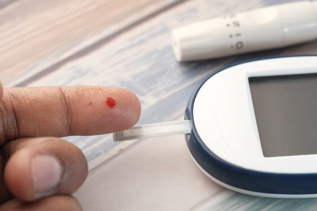 Flesh blood from diabetes patient finger to test glucose level blood .